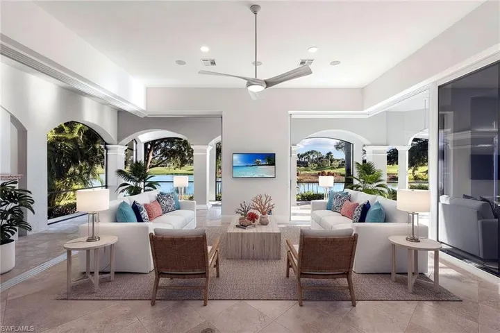 Family Room featuring retracting pocket-door sliders for seamless indoor-outdoor living | Shown with virtually staged furnishings for design inspiration