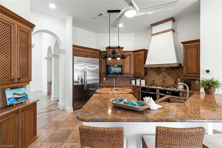 Breakfast bar easily seats 6 for friends and family to join in while cooking together