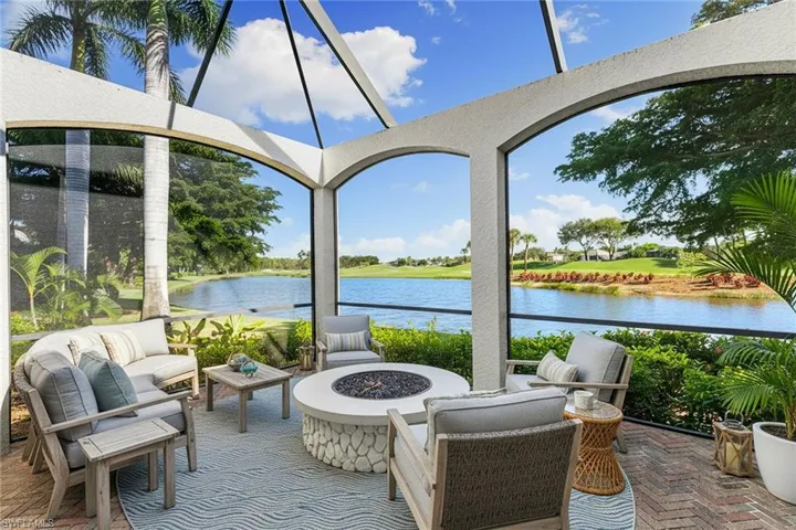 This additional lanai area compliments the outdoor living space and long water views out to the 9th hole fairway | Shown with virtually staged furnishings for design inspiration