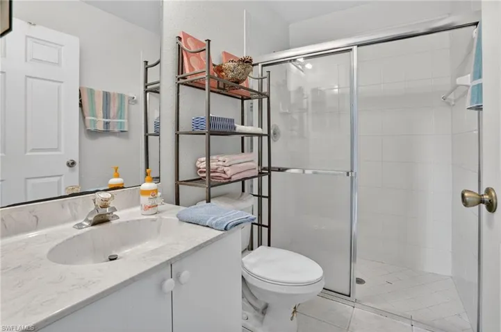 Full bathroom featuring vanity and a stall shower