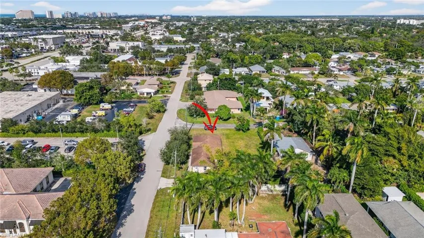 Aerial view of property and surrounding area with nearby suburban area and nearby urban area
