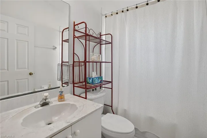 Bathroom with vanity and shower / bath combo