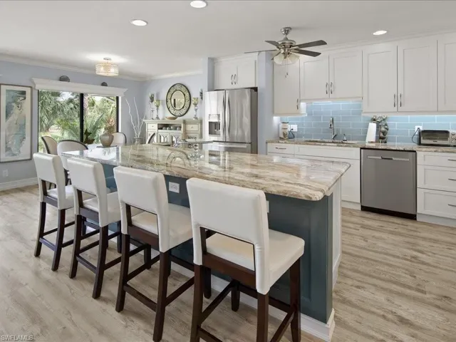 Large open kitchen. Love the color of the granite counters and specialty island