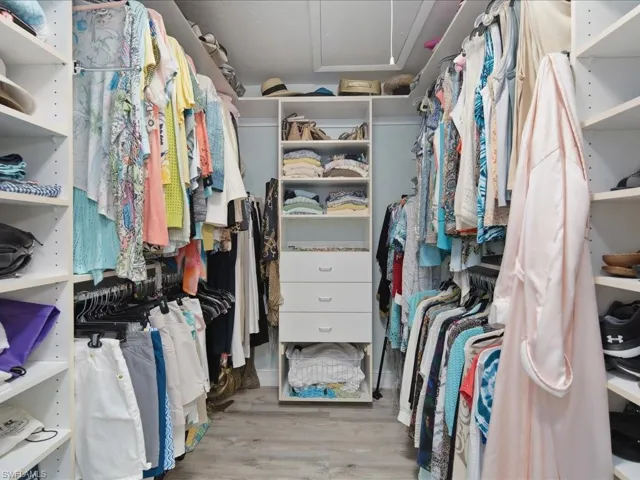 Large walk in closet with built-In's
