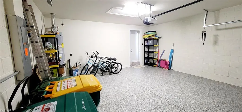 Garage with a garage door opener and water heater