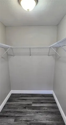 Very large walk in master bedroom closet.