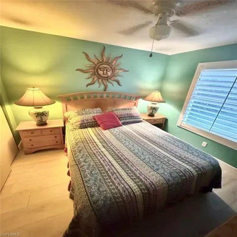 Bedroom with light wood-type flooring and ceiling fan