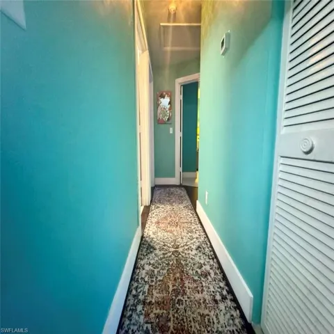 View of hallway to bedrooms and baths