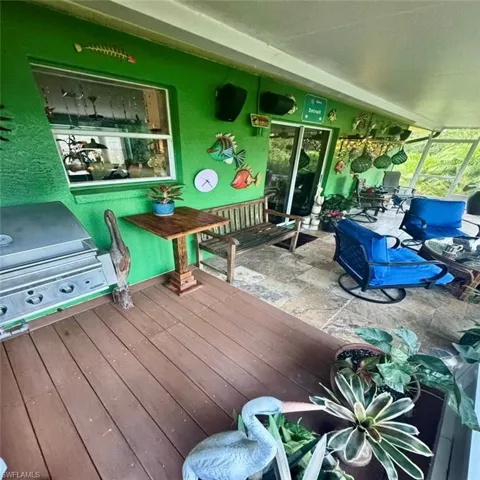Wooden deck featuring grilling area