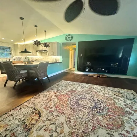 Living room featuring huge TV area for entertaining