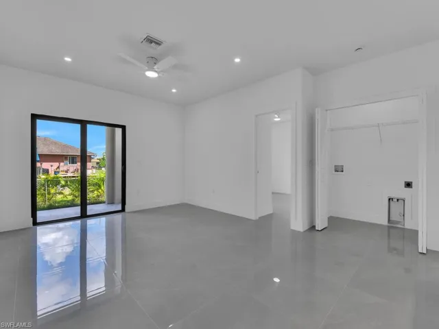 Spare room with recessed lighting, light tile patterned floors, and a ceiling fan