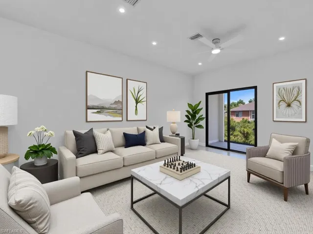 Carpeted living room featuring recessed lighting and ceiling fan