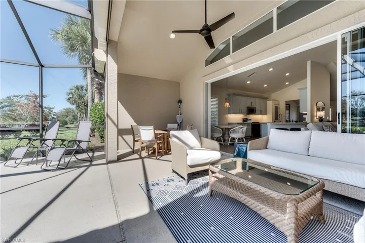 View of patio / terrace featuring a ceiling fan, outdoor dining space, a lanai, and an outdoor hangout area