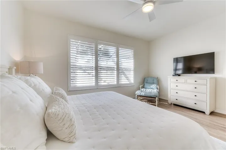 Bedroom featuring light wood-style floors and a ceiling fan