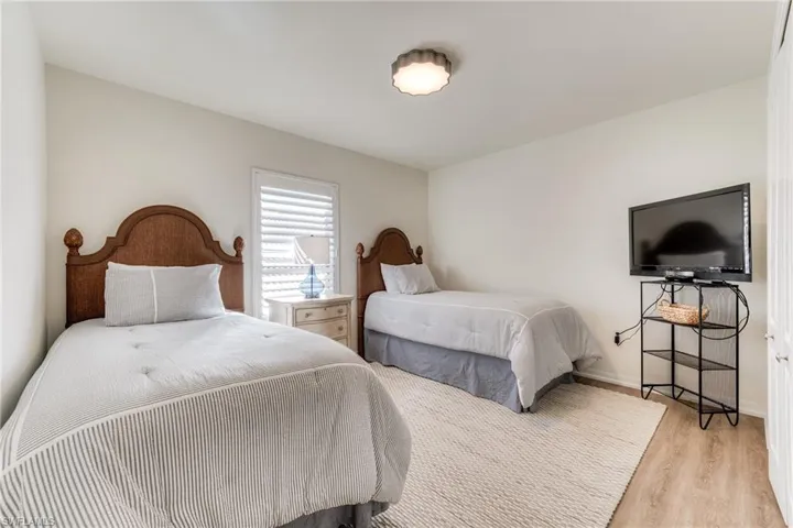 Bedroom featuring baseboards and light wood-style floors