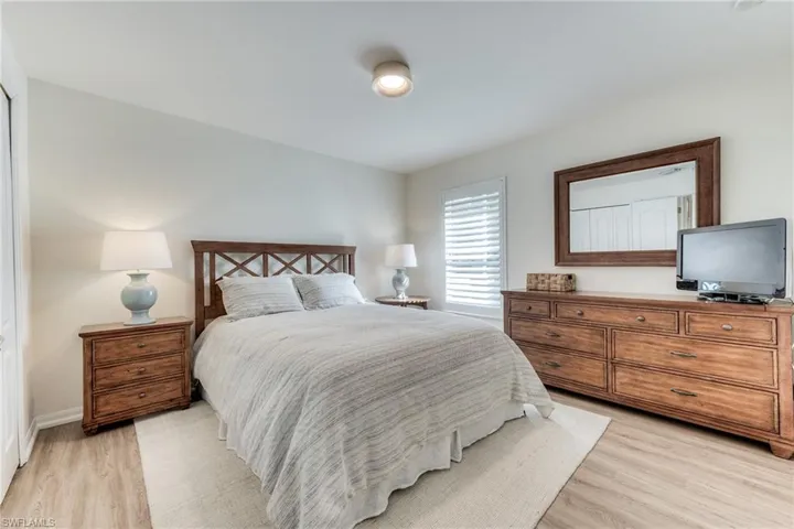 Bedroom featuring baseboards and light wood finished floors