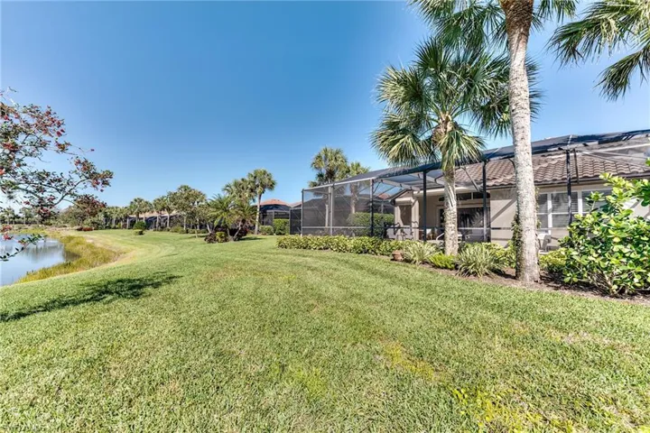 View of yard featuring glass enclosure