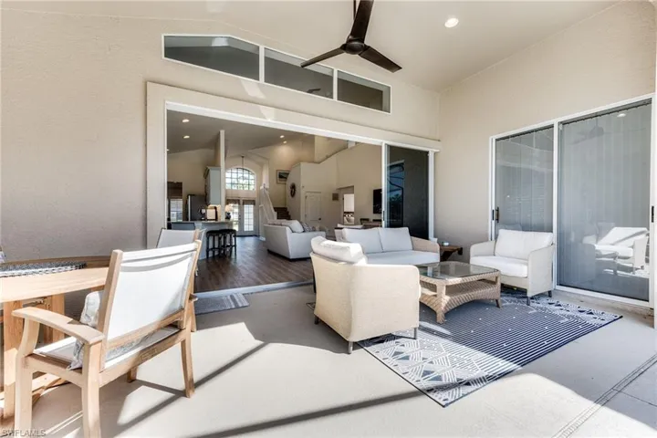 View of patio featuring ceiling fan and an outdoor living space