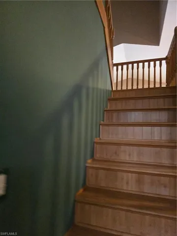 Wooden Staircase with landing to 2nd floor Loft.