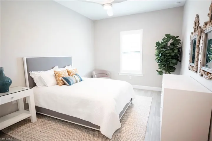 Bedroom featuring light hardwood / wood-style floors and ceiling fan