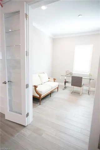 Sitting room featuring crown molding