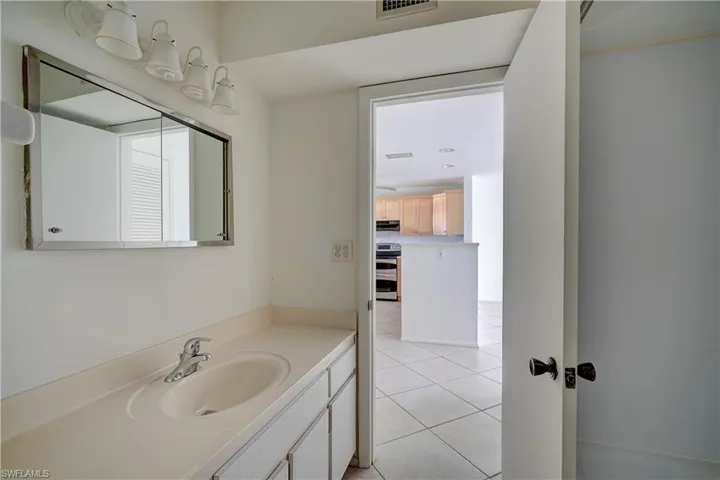 Bathroom featuring vanity and tile patterned floors