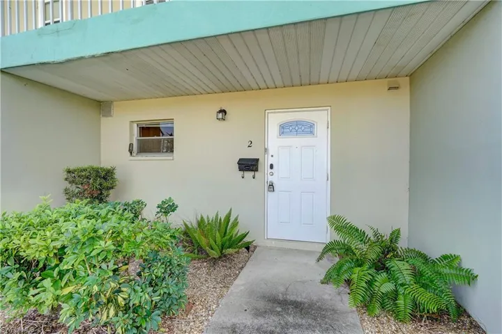 Property entrance featuring a balcony