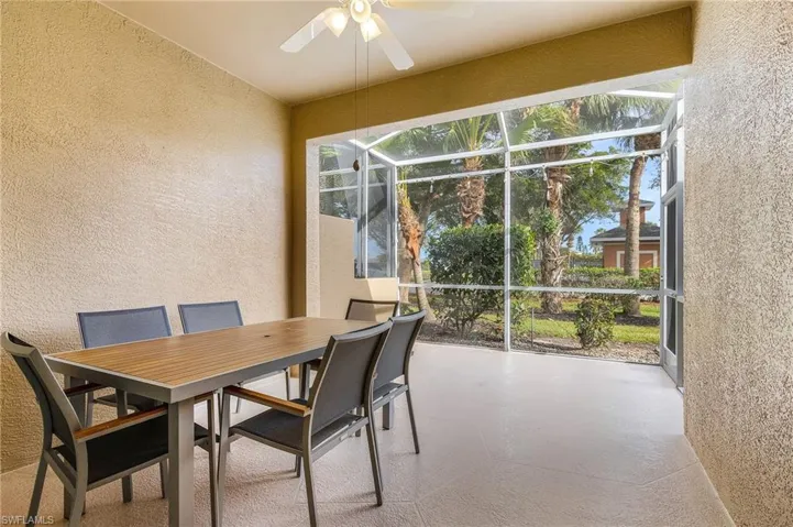 Sunroom featuring ceiling fan