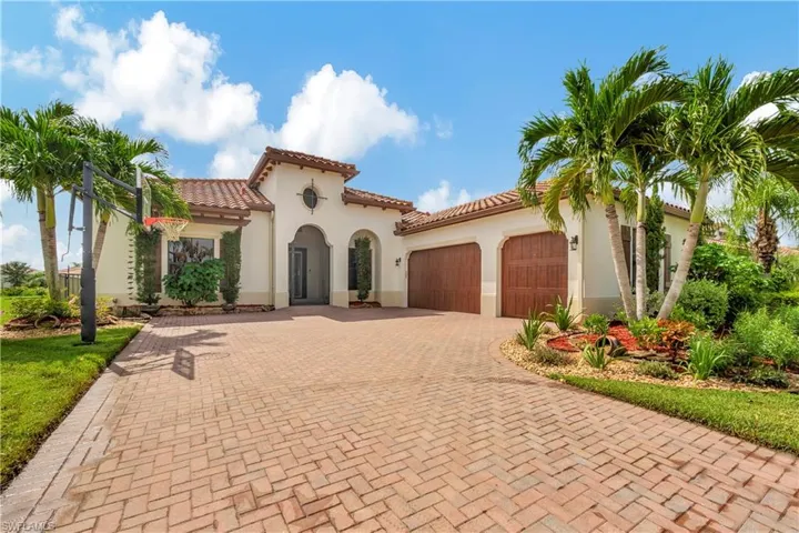 Mediterranean / spanish-style home featuring a garage