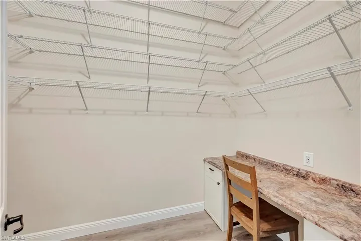 Spacious closet featuring light wood-type flooring