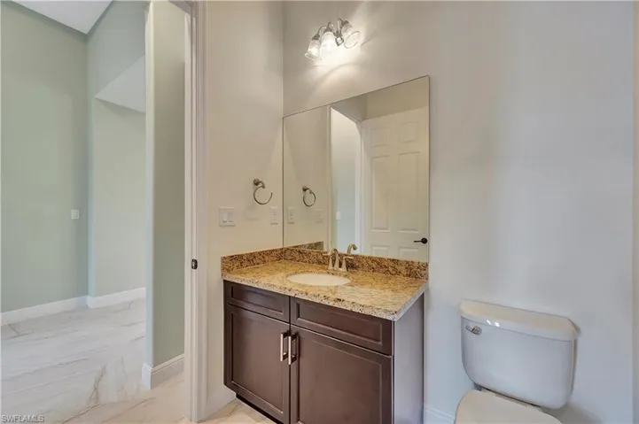 Bathroom featuring toilet and vanity