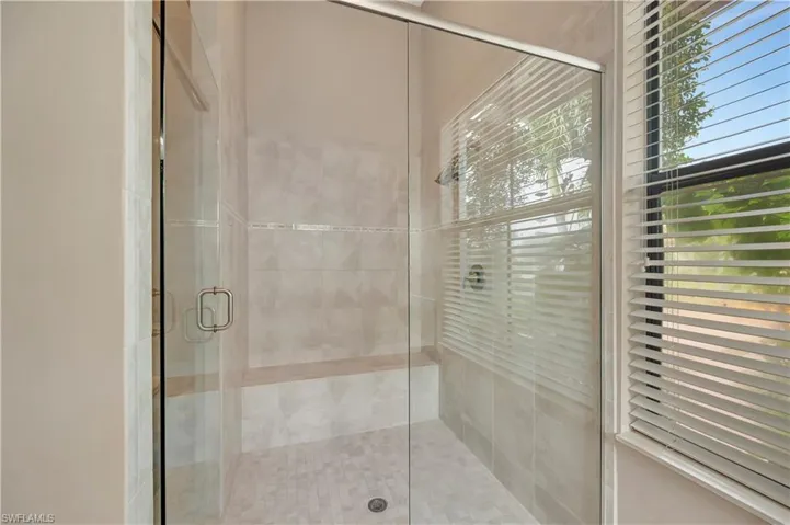 Bathroom featuring walk in shower