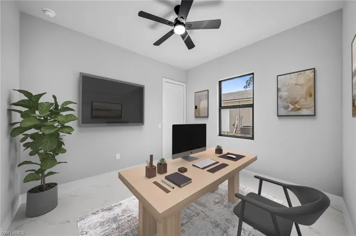 Office area featuring ceiling fan and light marble finish floors