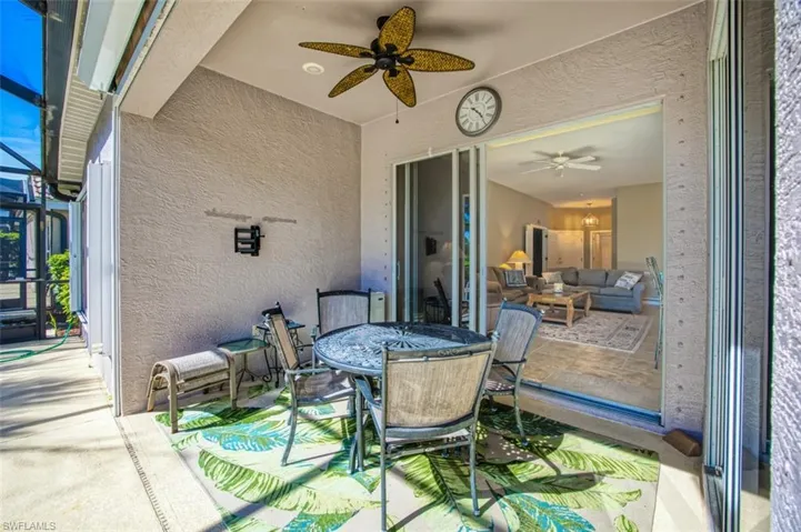 View of patio / terrace featuring ceiling fan, a sunroom, and a lanai