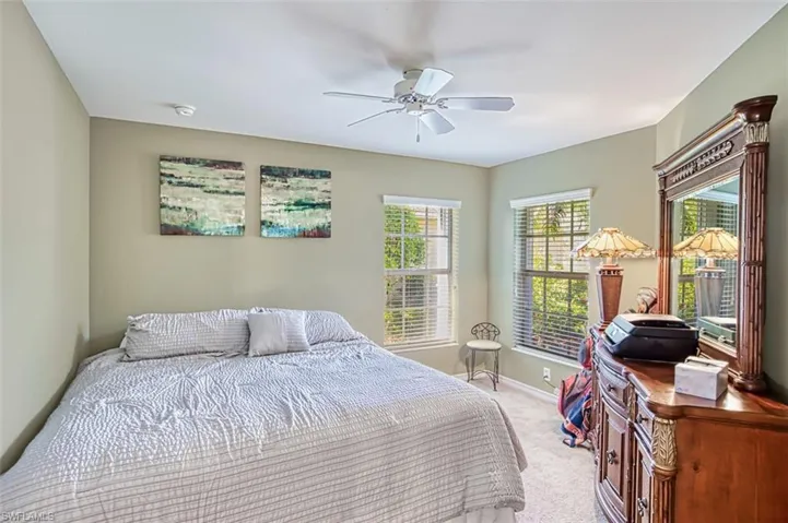 Bedroom with carpet flooring and a ceiling fan