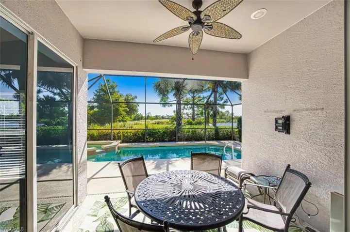 Sunroom / solarium featuring a pool