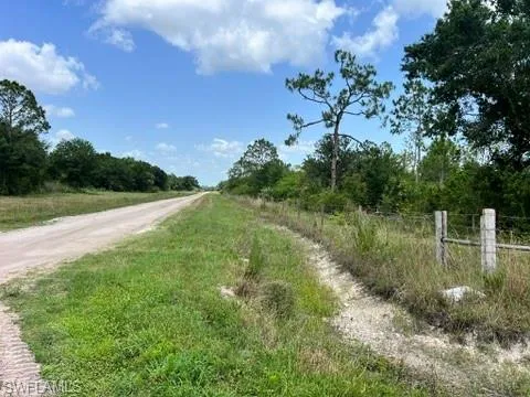 View of dirt / gravel road featuring a view of countryside