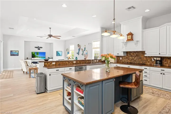 Kitchen featuring white cabinets and a kitchen island