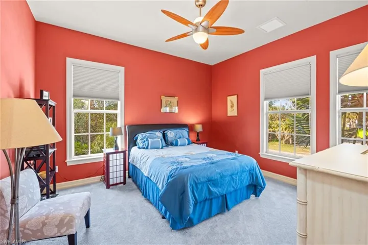 Bedroom featuring carpet and ceiling fan