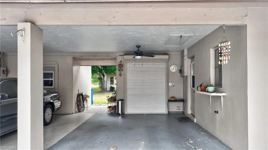 Laundry room with custom made electric garage door.