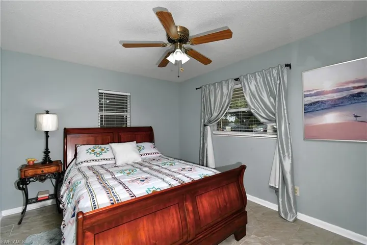 Bedroom featuring ceiling fan.
