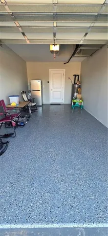 Garage with water heater, and a garage door opener