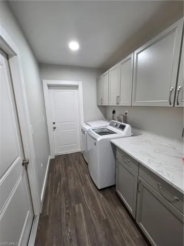 Plenty of cabinets and washer and dryer with a large safe included