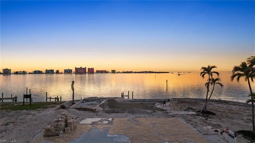 View of water feature with a dock