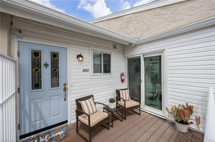 Front door on deck sliders to guest bedroom