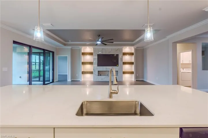 Spacious bathroom featuring wood-finish flooring and a large vanity with white cabinetry and a white countertop