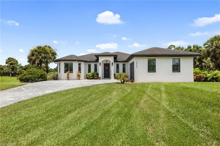 View of front of house with a front lawn
