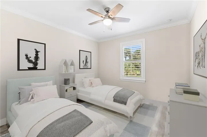 Bedroom featuring light hardwood / wood-style flooring, ceiling fan, and ornamental molding