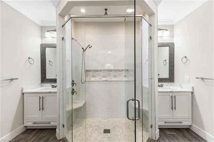 Bathroom with ornamental molding, vanity