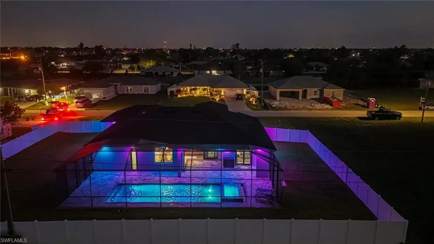 Pool at twilight with a jacuzzi